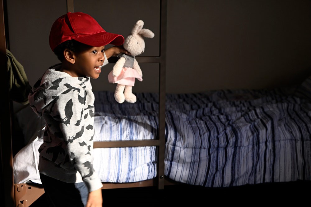 Photo of Boy Holding Stuffed Animal